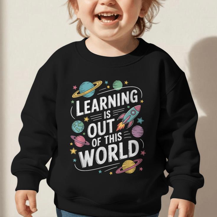 Learning Is Out Of This World Back To School Graphic Toddler Sweatshirt Learning Is Out Of This World Back To School Graphic Toddler Sweatshirt