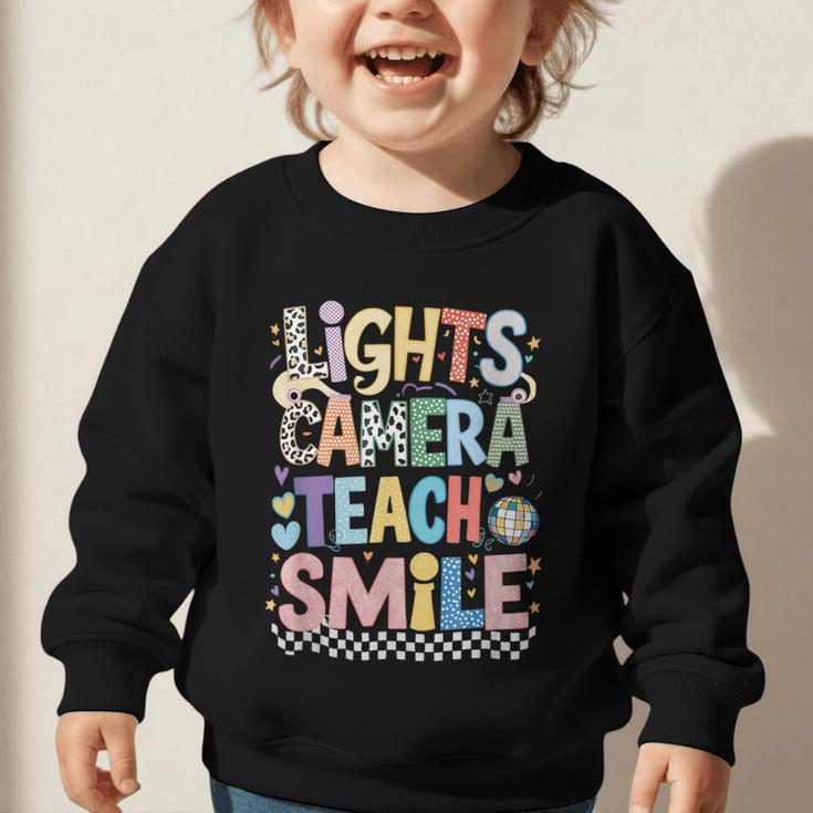 Lights Camera Teach Smile Back To School Awesome Learners Graphic Toddler Sweatshirt Lights Camera Teach Smile Back To School Awesome Learners Graphic Toddler Sweatshirt