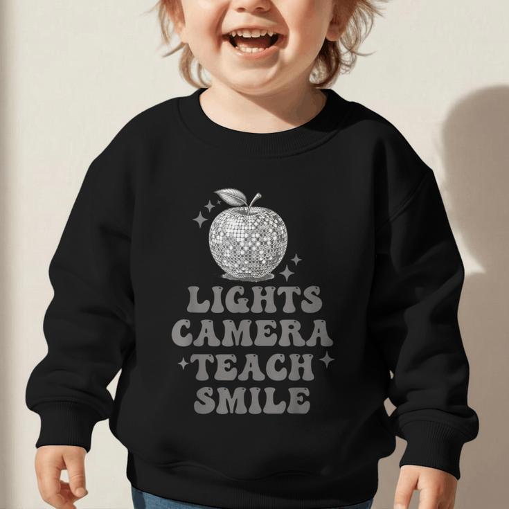 Lights Camera Teach Smile Disco-Ball Back To School Outfit Graphic Toddler Sweatshirt Lights Camera Teach Smile Disco-Ball Back To School Outfit Graphic Toddler Sweatshirt