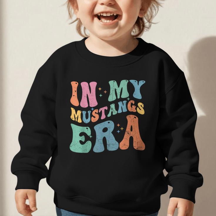 In My Mustangs Era Back To School Spirit Game Retro Groovy Graphic Toddler Sweatshirt In My Mustangs Era Back To School Spirit Game Retro Groovy Graphic Toddler Sweatshirt
