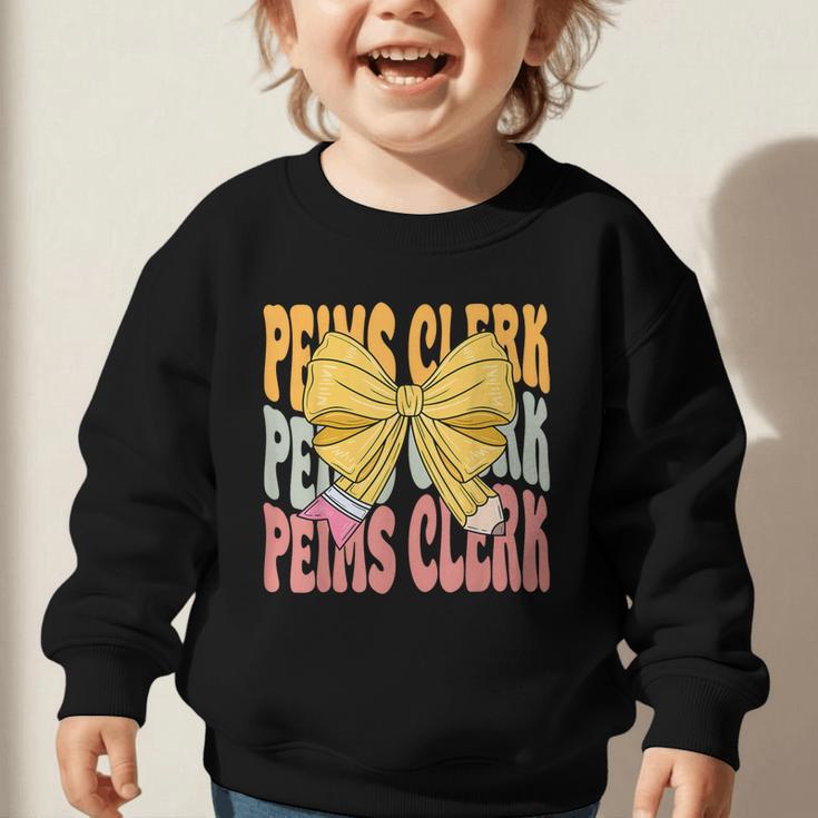 Peims Clerk Groovy Coquette Bow Cute Back To School Graphic Toddler Sweatshirt Peims Clerk Groovy Coquette Bow Cute Back To School Graphic Toddler Sweatshirt