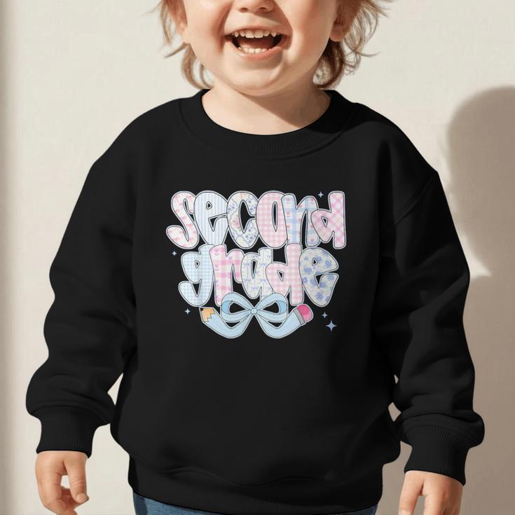 Second Grade Coquette Bow First Day Of School Back To School Graphic Toddler Sweatshirt Second Grade Coquette Bow First Day Of School Back To School Graphic Toddler Sweatshirt