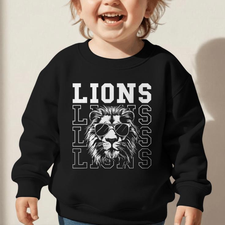 Vintage Lions School Spirit Fan Team Back To School Graphic Toddler Sweatshirt Vintage Lions School Spirit Fan Team Back To School Graphic Toddler Sweatshirt