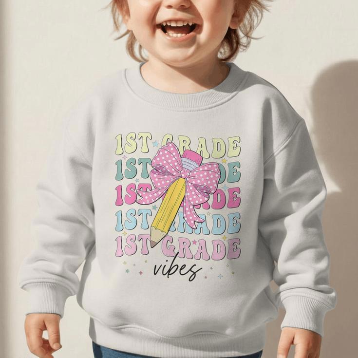 1st Grade Vibes Girl Coquette Bow First Grade Back To School Graphic Toddler Sweatshirt 1st Grade Vibes Girl Coquette Bow First Grade Back To School Graphic Toddler Sweatshirt