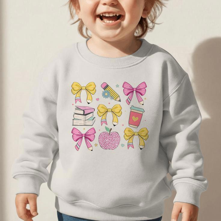 Apple Coquette Bow Books First Day Of School Back To School Graphic Toddler Sweatshirt Apple Coquette Bow Books First Day Of School Back To School Graphic Toddler Sweatshirt