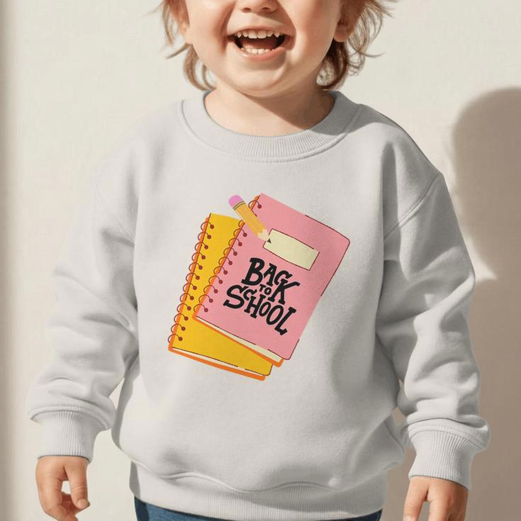 Back To School Notebook And Pencil Graphic Design Premium Tri-Blend Graphic Toddler Sweatshirt Back To School Notebook And Pencil Graphic Design Premium Tri-Blend Graphic Toddler Sweatshirt