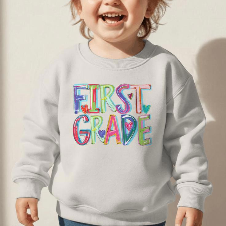 First Grade Back To School Happy First Day Of School Graphic Toddler Sweatshirt First Grade Back To School Happy First Day Of School Graphic Toddler Sweatshirt
