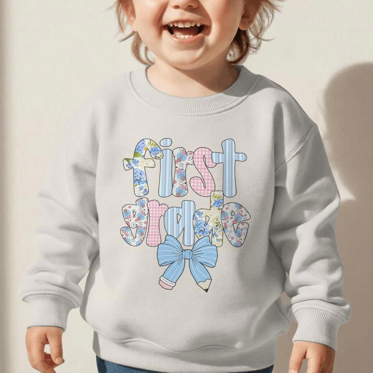 First Grade Coquette Bow Pencil First Day Back To School Performance Graphic Toddler Sweatshirt First Grade Coquette Bow Pencil First Day Back To School Performance Graphic Toddler Sweatshirt
