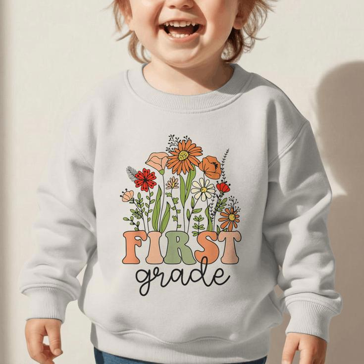 Groovy First Grade Wildflowers Back To School 1st Grade Graphic Toddler Sweatshirt Groovy First Grade Wildflowers Back To School 1st Grade Graphic Toddler Sweatshirt