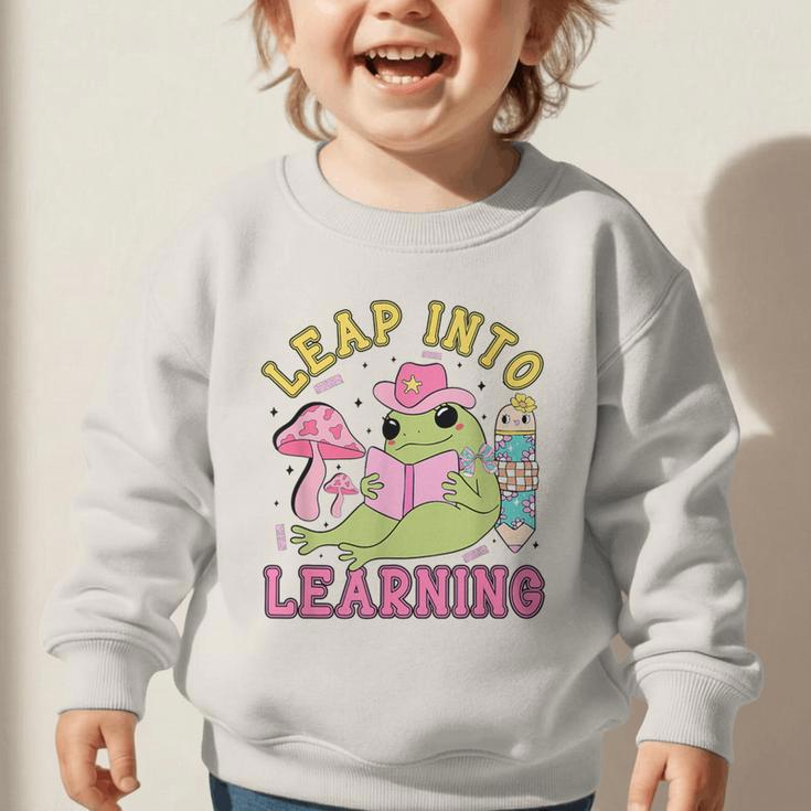 Leap Into Learning Cute Frog Kawaii Back To School Kids Graphic Toddler Sweatshirt Leap Into Learning Cute Frog Kawaii Back To School Kids Graphic Toddler Sweatshirt