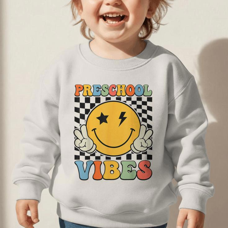Preschool Vibes Retro Groovy Back To School Pre-K Graphic Toddler Sweatshirt Preschool Vibes Retro Groovy Back To School Pre-K Graphic Toddler Sweatshirt