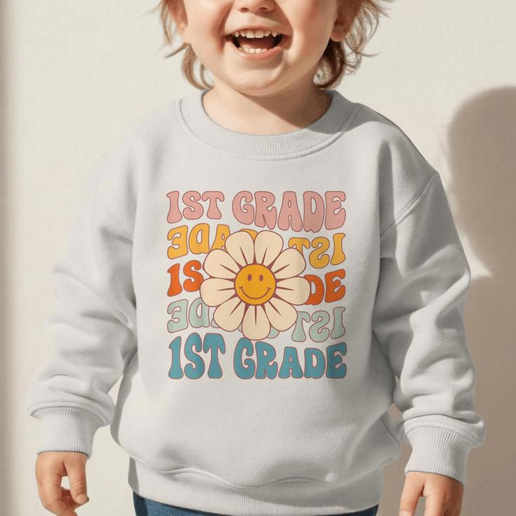 Retro 1st Grade Daisy Colorful Back To School First Grade Graphic Toddler Sweatshirt