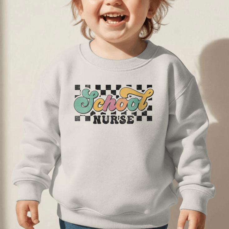 Retro Checkered School Nurse Squad Back To School Graduation Graphic Toddler Sweatshirt Retro Checkered School Nurse Squad Back To School Graduation Graphic Toddler Sweatshirt