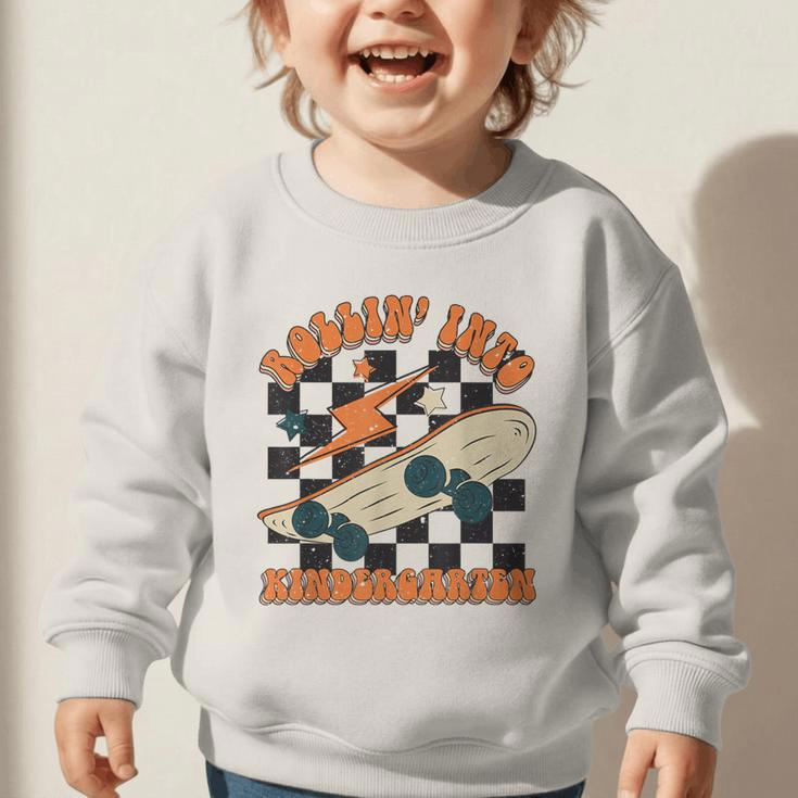 Rolling Into Kindergarten Retro Groovy Back To School Kids Graphic Toddler Sweatshirt Rolling Into Kindergarten Retro Groovy Back To School Kids Graphic Toddler Sweatshirt
