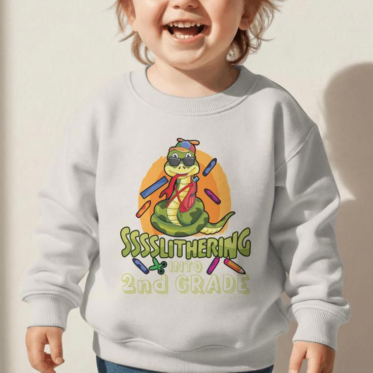 Slithering Into 2nd Grade First Day Back To School Snake Performance Graphic Toddler Sweatshirt Slithering Into 2nd Grade First Day Back To School Snake Performance Graphic Toddler Sweatshirt