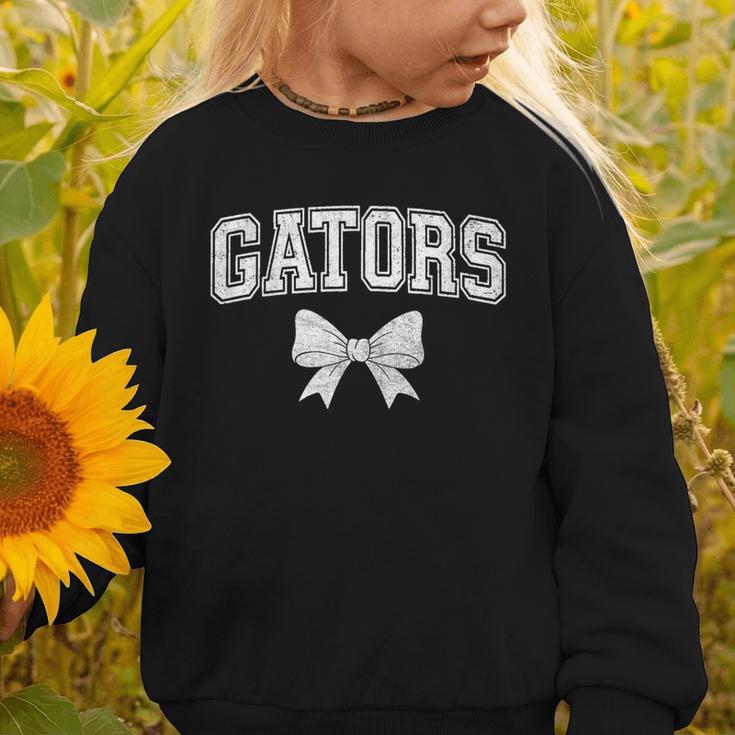Gators High School Coquette Bow Gator Back To School Graphic Toddler Sweatshirt Gators High School Coquette Bow Gator Back To School Graphic Toddler Sweatshirt