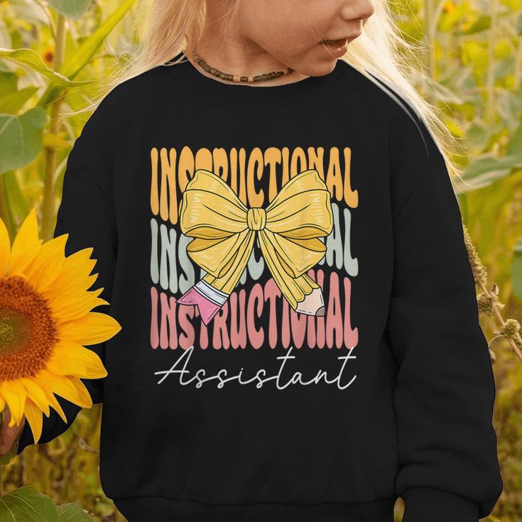 Instructional Assistant Groovy Coquette Bow Back To School Graphic Toddler Sweatshirt Instructional Assistant Groovy Coquette Bow Back To School Graphic Toddler Sweatshirt