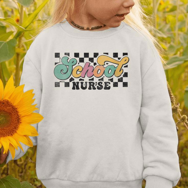 Retro Checkered School Nurse Squad Back To School Graduation Graphic Toddler Sweatshirt Retro Checkered School Nurse Squad Back To School Graduation Graphic Toddler Sweatshirt