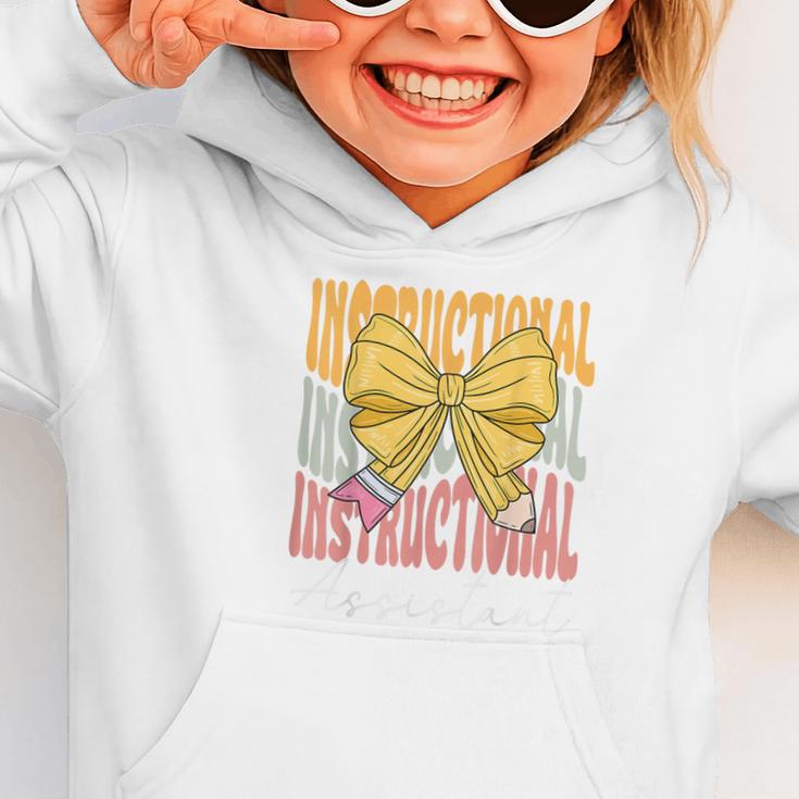 Instructional Assistant Groovy Coquette Bow Back To School Graphic Toddler Hoodie Instructional Assistant Groovy Coquette Bow Back To School Graphic Toddler Hoodie
