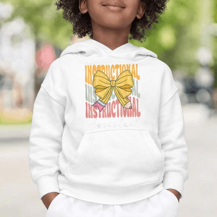 Instructional Assistant Groovy Coquette Bow Back To School Graphic Toddler Hoodie Instructional Assistant Groovy Coquette Bow Back To School Graphic Toddler Hoodie