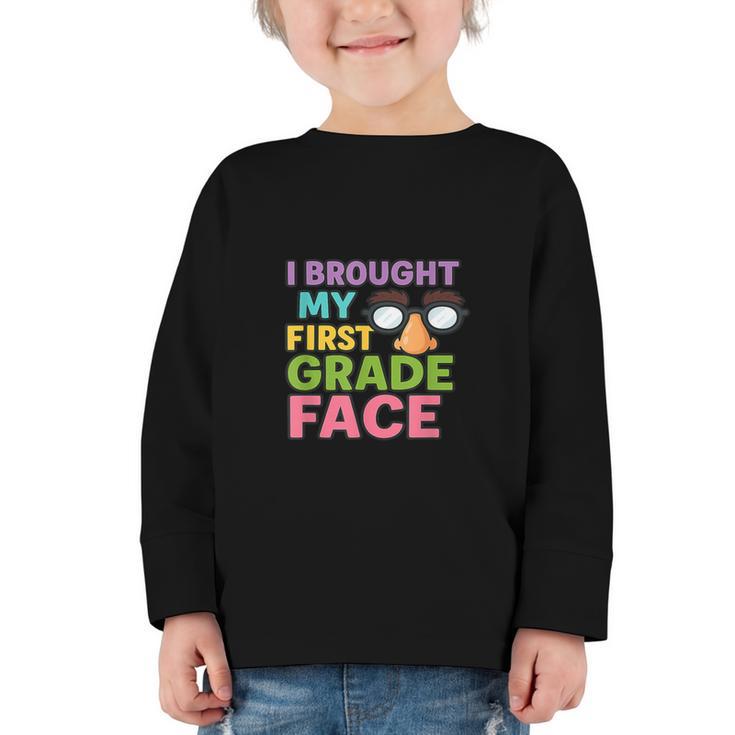I Brought My First Grade Face First Day Back To School Graphic Toddler Long Sleeve Tee