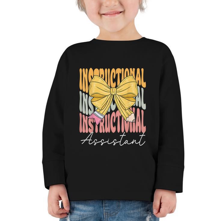 Instructional Assistant Groovy Coquette Bow Back To School Graphic Toddler Long Sleeve Tee Instructional Assistant Groovy Coquette Bow Back To School Graphic Toddler Long Sleeve Tee
