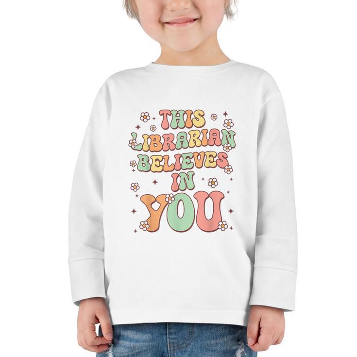 This Librarian Believes In You Groovy Back To School Graphic Toddler Long Sleeve Tee