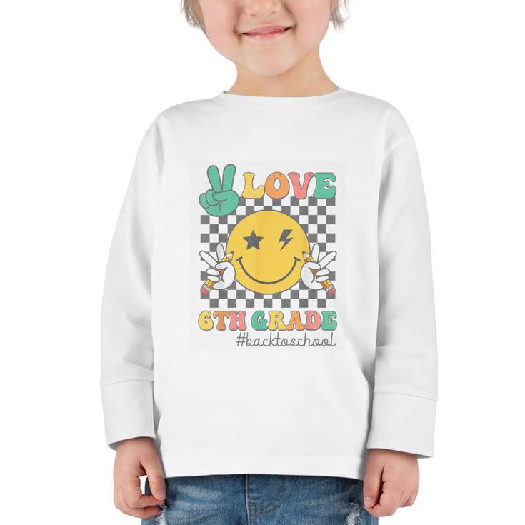 Peace Love 6th Grade Smile Face Back To School Sixth Grade Graphic Toddler Long Sleeve Tee