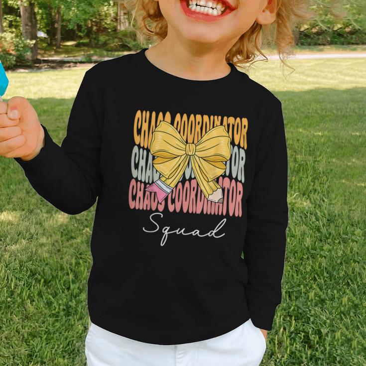 Chaos Coordinator Squad Groovy Coquette Bow Back To School Graphic Toddler Long Sleeve Tee Chaos Coordinator Squad Groovy Coquette Bow Back To School Graphic Toddler Long Sleeve Tee