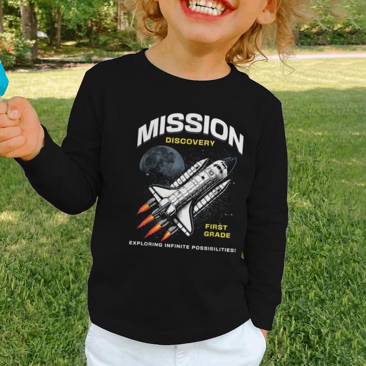 First Grade Back To School Space Rocket Astronaut Graphic Toddler Long Sleeve Tee First Grade Back To School Space Rocket Astronaut Graphic Toddler Long Sleeve Tee