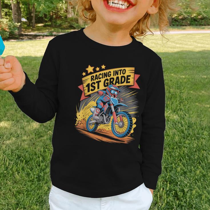 Motocross Dirt Bike Back To School Racing Into 1st Grade Graphic Toddler Long Sleeve Tee Motocross Dirt Bike Back To School Racing Into 1st Grade Graphic Toddler Long Sleeve Tee