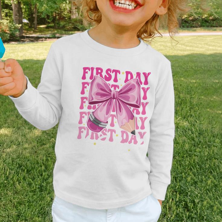 First Day Of School Girls Coquette Bow Back To School Performance Graphic Toddler Long Sleeve Tee First Day Of School Girls Coquette Bow Back To School Performance Graphic Toddler Long Sleeve Tee