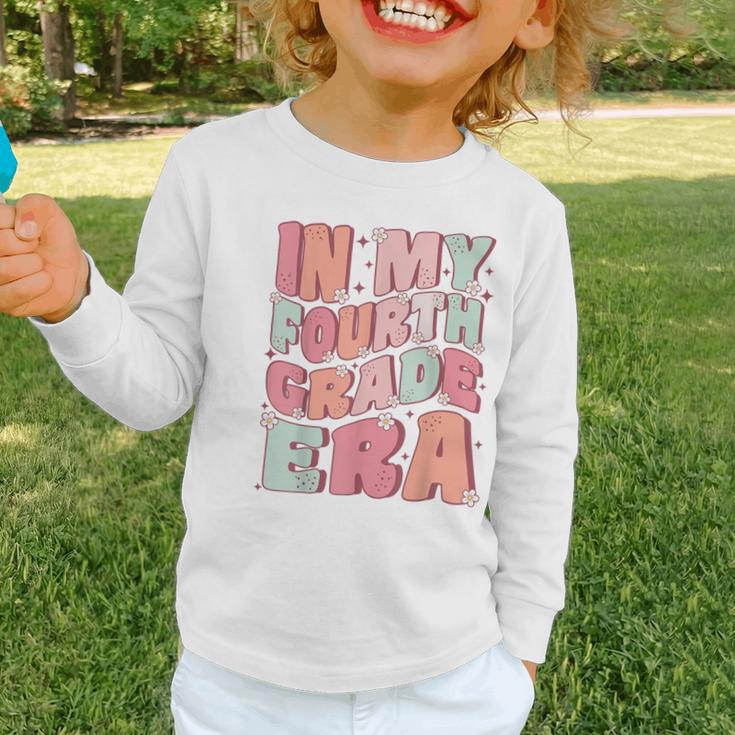 In My Fourth Grade Era Cute Groovy 4th Grade Back To School Graphic Toddler Long Sleeve Tee In My Fourth Grade Era Cute Groovy 4th Grade Back To School Graphic Toddler Long Sleeve Tee