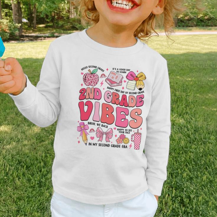 Girls 2nd Grade Vibes Coquette Pink Bow Back To School Graphic Toddler Long Sleeve Tee