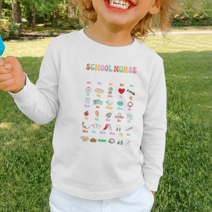 Groovy Cute ABC School Nurse Alphabet Back To School Women Graphic Toddler Long Sleeve Tee Groovy Cute ABC School Nurse Alphabet Back To School Women Graphic Toddler Long Sleeve Tee