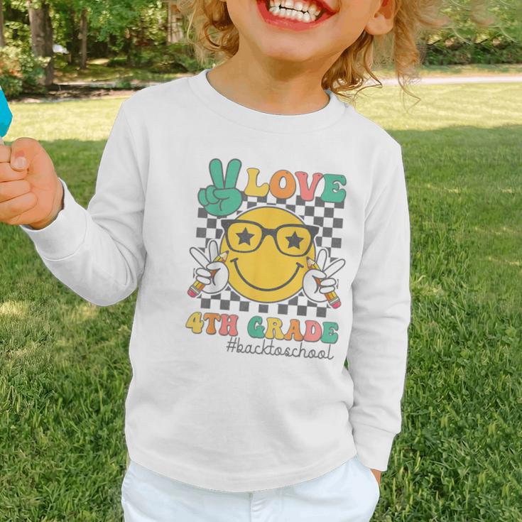 Peace Love 4th Grade Cute Smile Face Back To School Girls Graphic Toddler Long Sleeve Tee Peace Love 4th Grade Cute Smile Face Back To School Girls Graphic Toddler Long Sleeve Tee