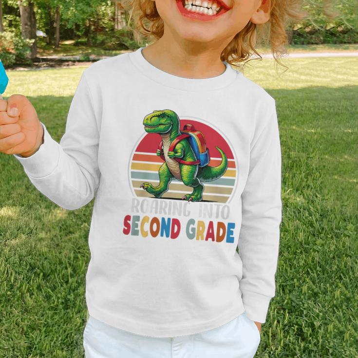 Roaring Into Second Grade T-Rex Back To School 2nd Grade Premium Tri-Blend Graphic Toddler Long Sleeve Tee Roaring Into Second Grade T-Rex Back To School 2nd Grade Premium Tri-Blend Graphic Toddler Long Sleeve Tee