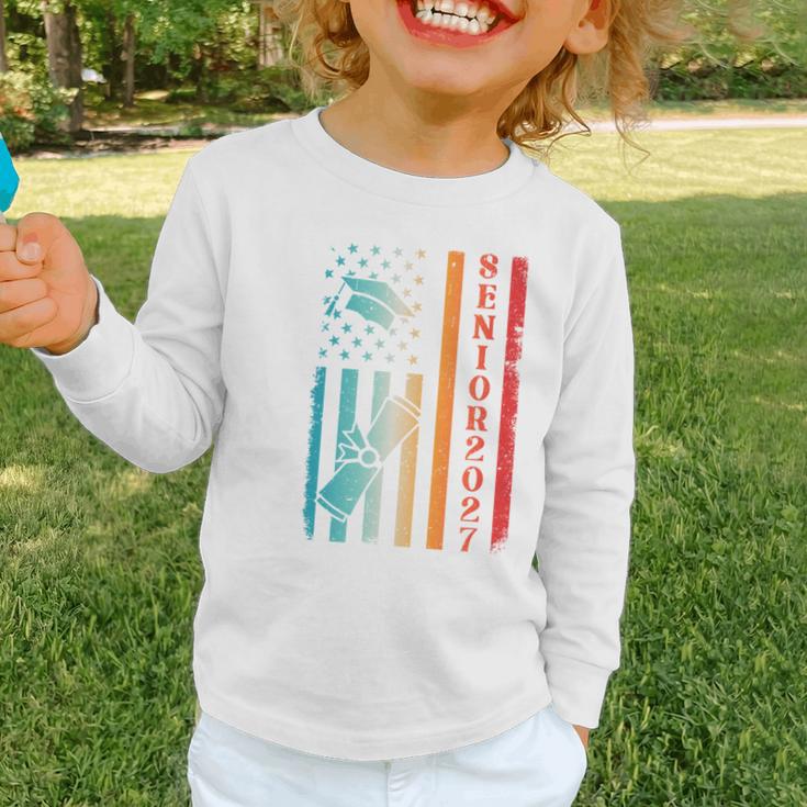 Senior 2027 Class Of 2027 Graduation USA Flag Back To School Performance Graphic Toddler Long Sleeve Tee