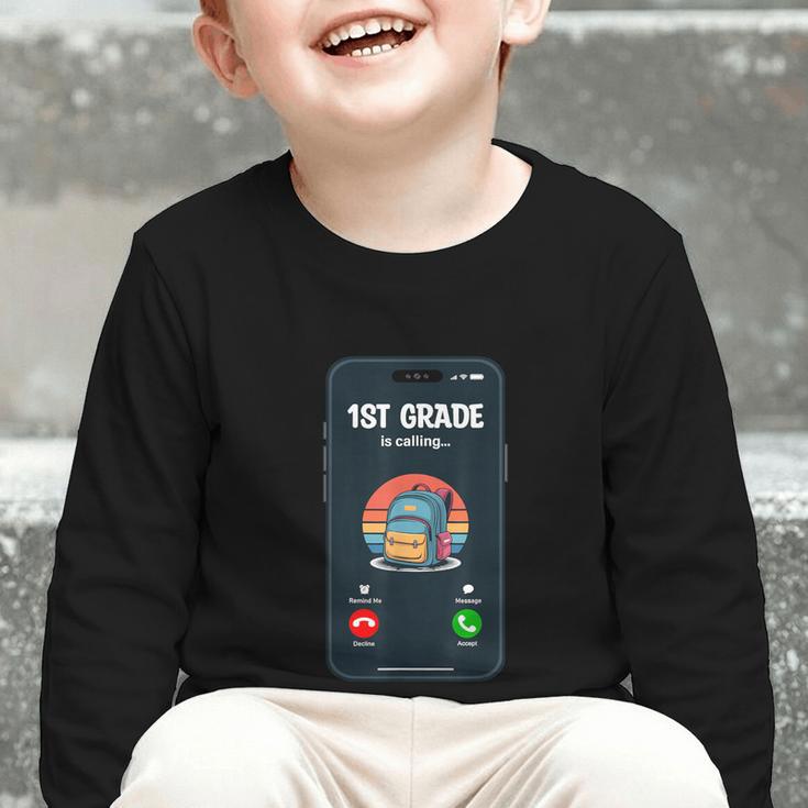 1st Grade Is Calling First Day Back To School First Grade Graphic Toddler Long Sleeve Tee