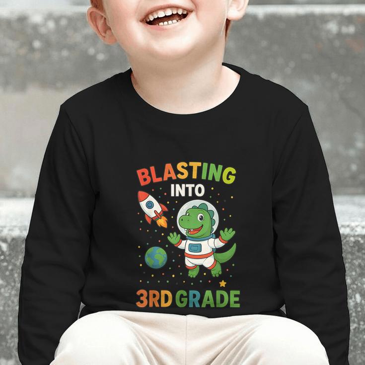 Blasting Into 3rd Grade Dinosaur Astronaut Back To School Graphic Toddler Long Sleeve Tee Blasting Into 3rd Grade Dinosaur Astronaut Back To School Graphic Toddler Long Sleeve Tee