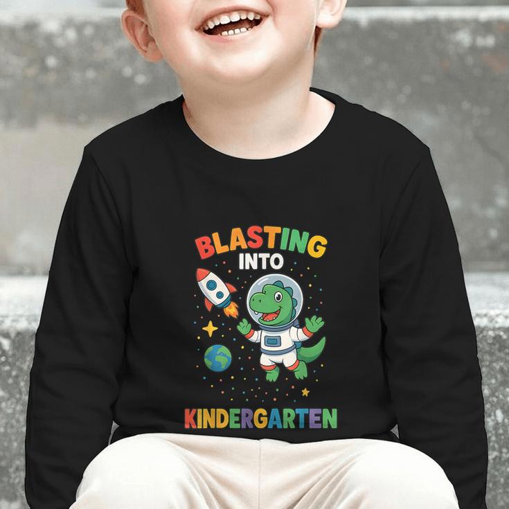 Blasting Into Kindergarten Dinosaur Astronaut Back To School Graphic Toddler Long Sleeve Tee Blasting Into Kindergarten Dinosaur Astronaut Back To School Graphic Toddler Long Sleeve Tee
