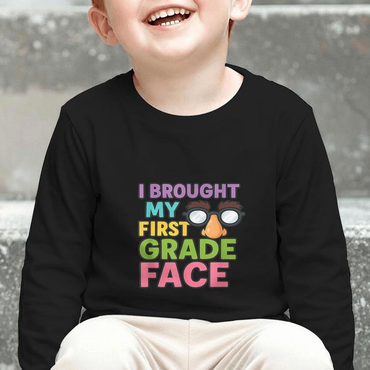 I Brought My First Grade Face First Day Back To School Graphic Toddler Long Sleeve Tee I Brought My First Grade Face First Day Back To School Graphic Toddler Long Sleeve Tee
