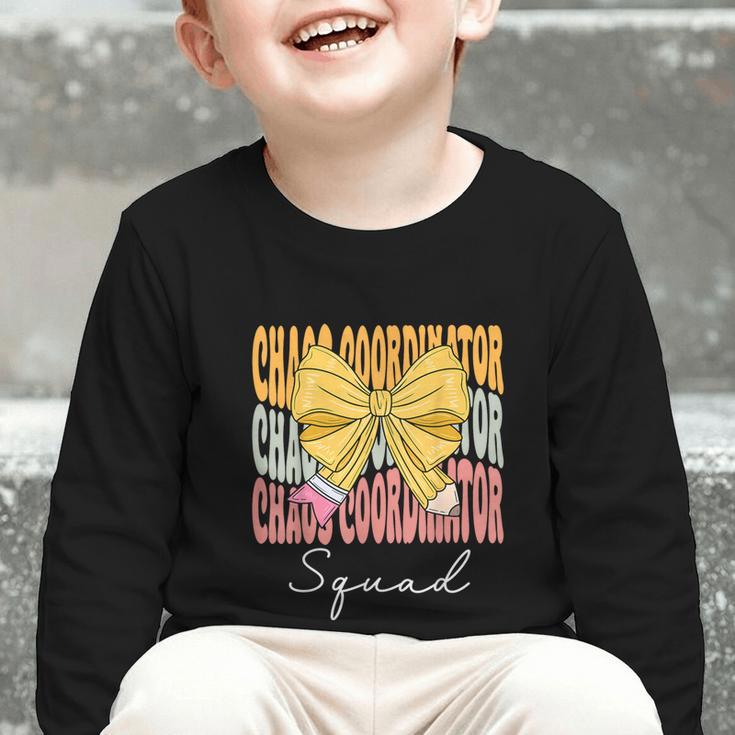 Chaos Coordinator Squad Groovy Coquette Bow Back To School Graphic Toddler Long Sleeve Tee Chaos Coordinator Squad Groovy Coquette Bow Back To School Graphic Toddler Long Sleeve Tee