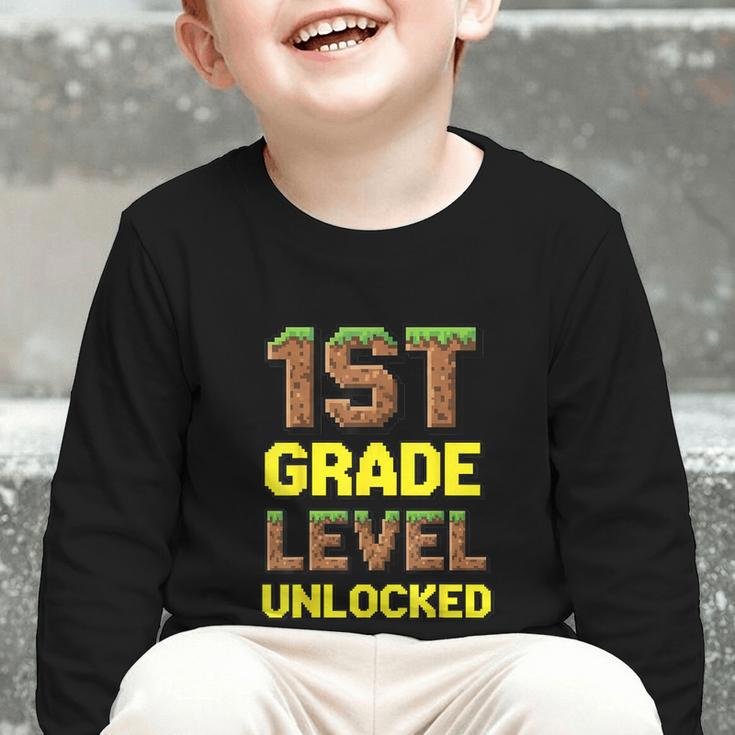 First Day Of 1st Grade Level Unlocked Back To School For Boy Graphic Toddler Long Sleeve Tee First Day Of 1st Grade Level Unlocked Back To School For Boy Graphic Toddler Long Sleeve Tee