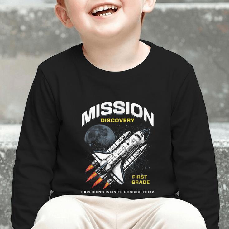 First Grade Back To School Space Rocket Astronaut Graphic Toddler Long Sleeve Tee First Grade Back To School Space Rocket Astronaut Graphic Toddler Long Sleeve Tee