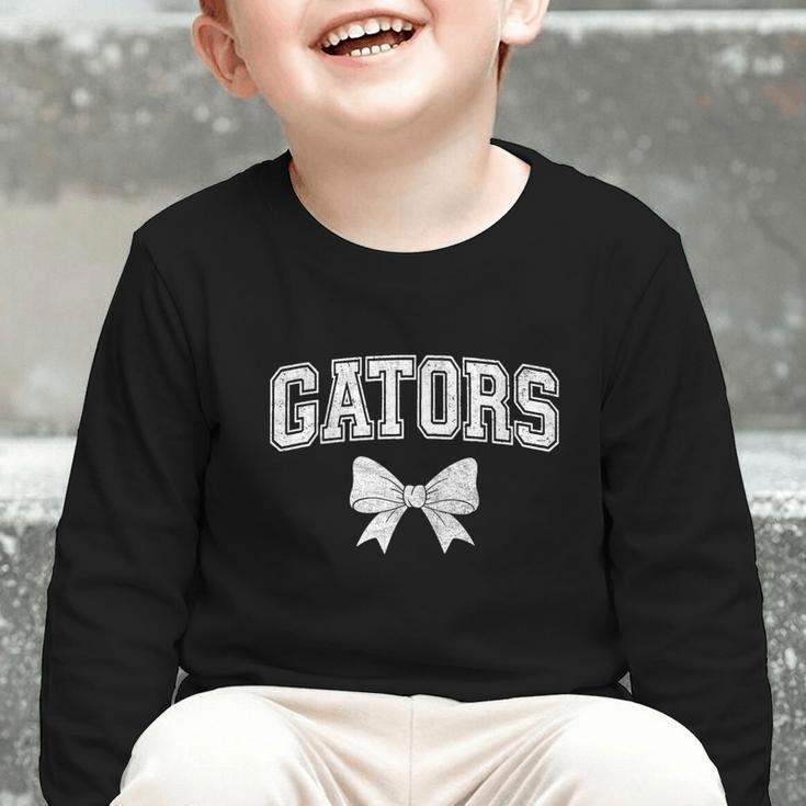 Gators High School Coquette Bow Gator Back To School Graphic Toddler Long Sleeve Tee
