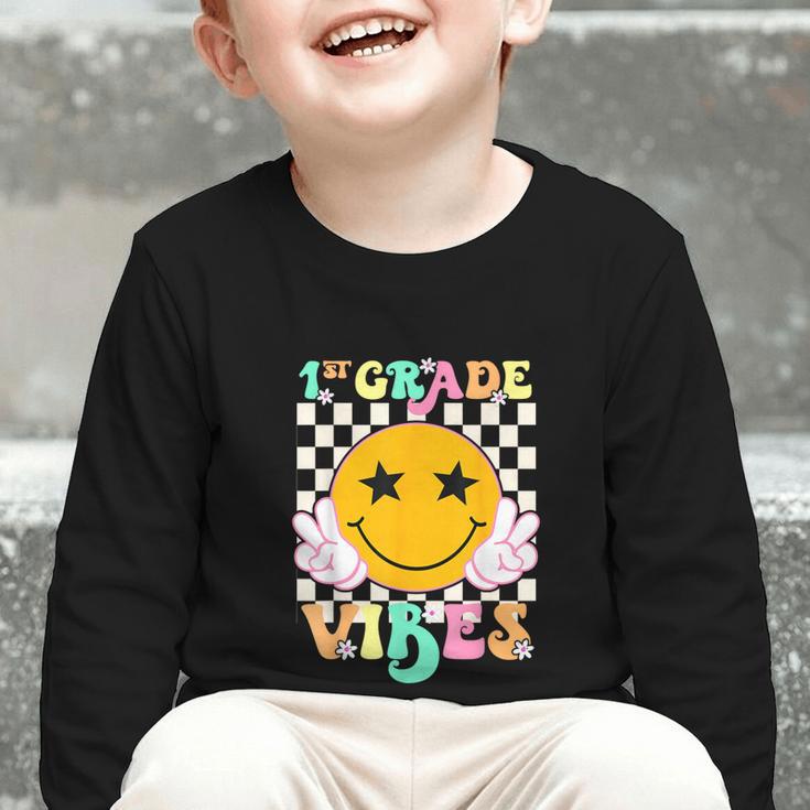 Girls 1st Grade Vibes Smile Face Back To School 1st Grade Graphic Toddler Long Sleeve Tee Girls 1st Grade Vibes Smile Face Back To School 1st Grade Graphic Toddler Long Sleeve Tee