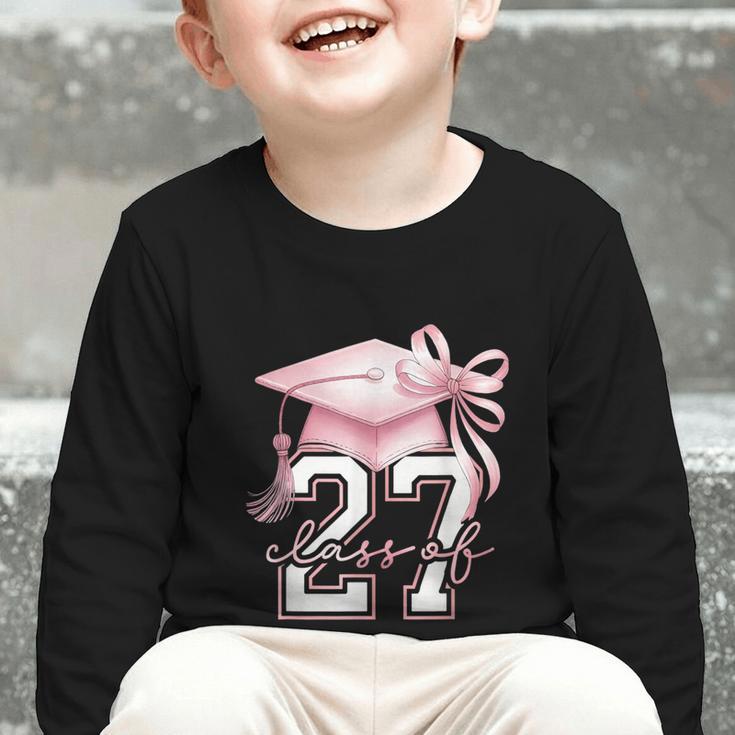 Girls Class Of 2027 Back To School Senior 2027 Coquette Bow Graphic Toddler Long Sleeve Tee Girls Class Of 2027 Back To School Senior 2027 Coquette Bow Graphic Toddler Long Sleeve Tee