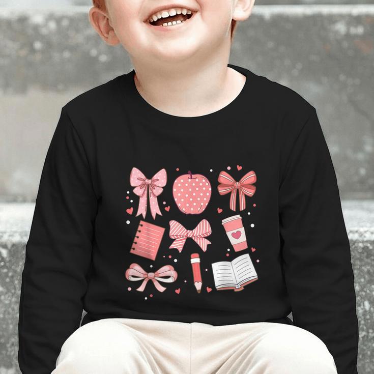 Happy Back To School 1st Day Toddler Girl Boho Coquette Bows Graphic Toddler Long Sleeve Tee Happy Back To School 1st Day Toddler Girl Boho Coquette Bows Graphic Toddler Long Sleeve Tee