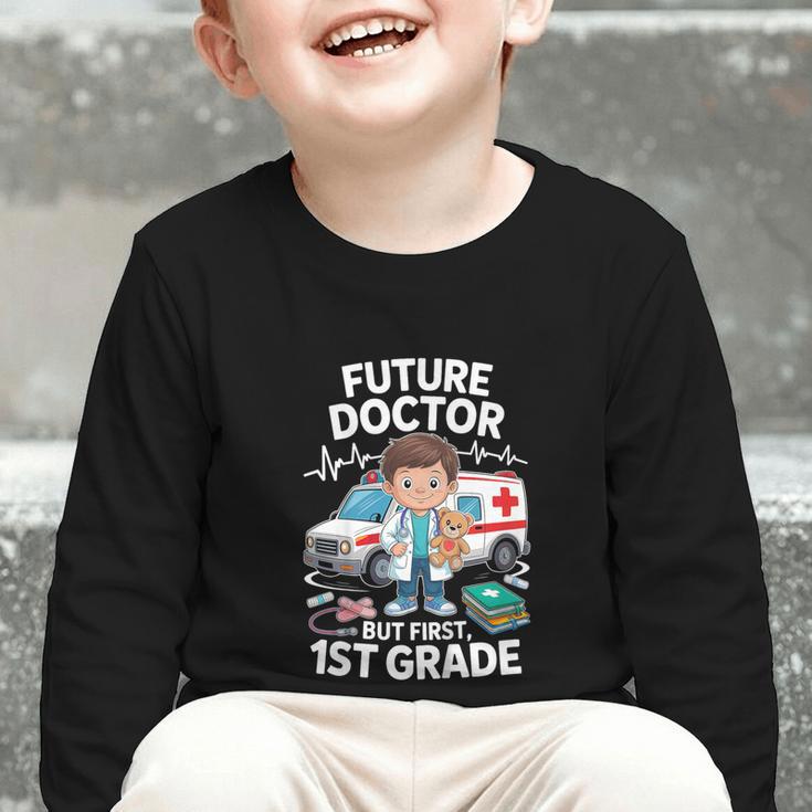 Kids Future Doctor 1st Grade Student Back To School Boy Kids Graphic Toddler Long Sleeve Tee Kids Future Doctor 1st Grade Student Back To School Boy Kids Graphic Toddler Long Sleeve Tee